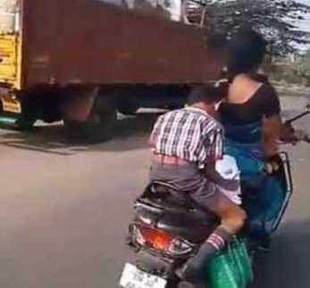 டூவீலரில் போகும் போது ஹோம் ஒர்க் எழுதும் பள்ளிச் சிறுவன் VIDEO