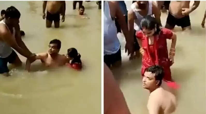 ஆற்றில் மனைவிக்கு முத்தம்கொடுத்த கணவன்.. தர்மஅடி கொடுத்த மக்கள்- வீடியோ !!