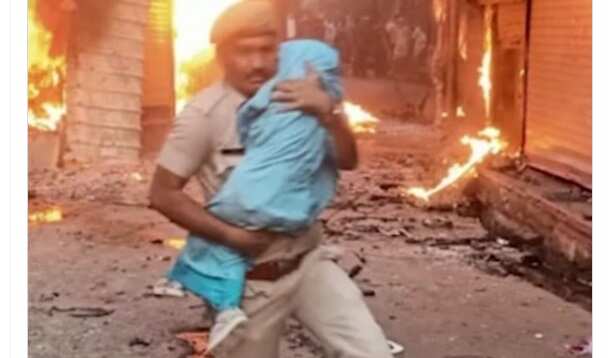 நிஜ ஹீரோவுக்கு சல்யூட் ! தீப்பற்றி எரியும் கட்டிடத்தில் இருந்து குழந்தையை காப்பாற்றிய போலீஸ் !!